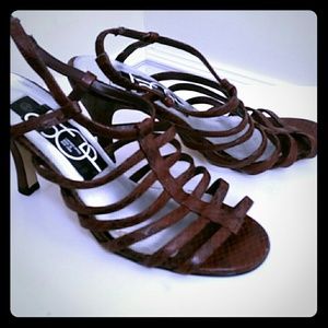 Stop strappy leopard heeled sandals.